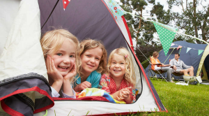 Luxury camping and glamping gear: family on campsite